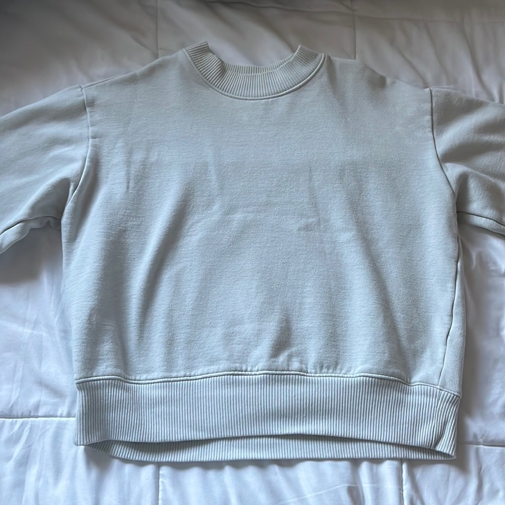 light green sweater